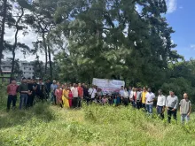 पौधारोपण अभियान में भाग लेते NEC के अधिकारी