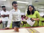 Director (Admn.) M. Gangte and Under Secretary Shrutimala Rajbongshi examining a pen stand made by a participant during the Waste to Art Design Competition