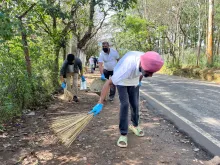 NEC staff engaged in cleanliness efforts during the Transfor