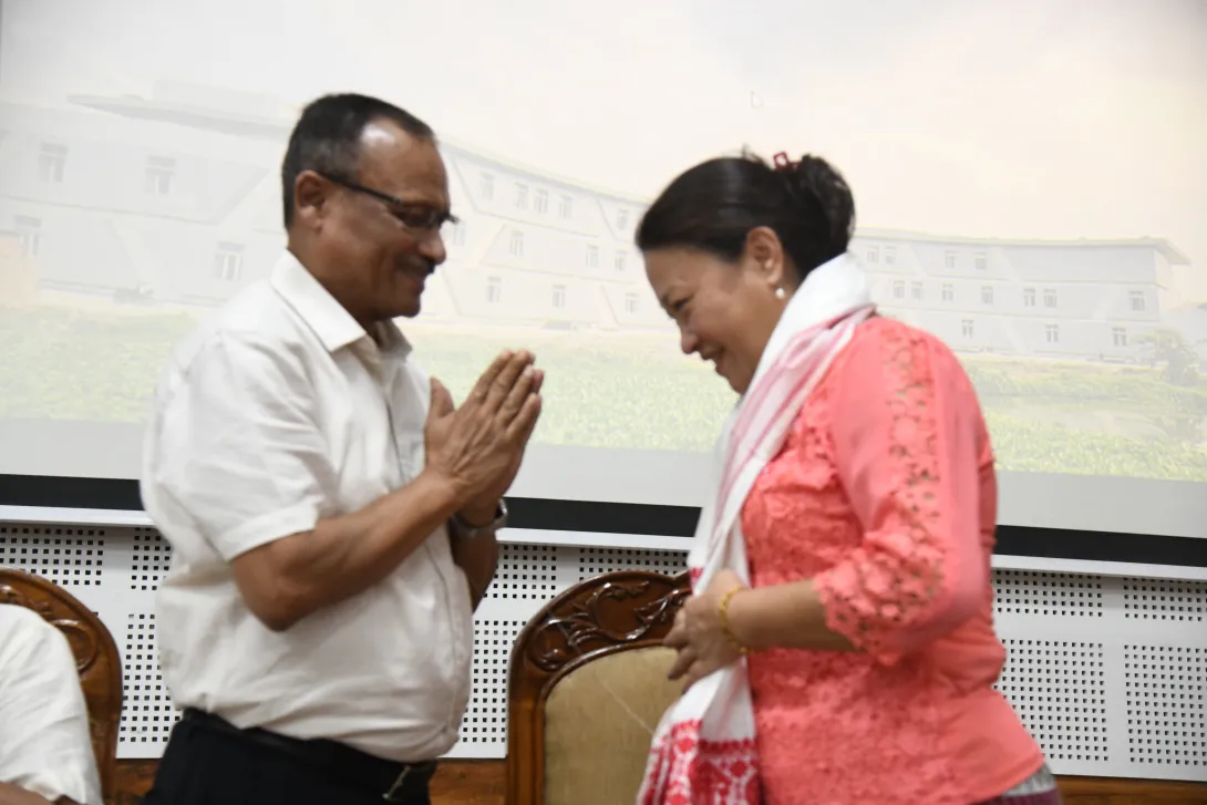 Ms. Sherry Lalthangzo, Economic Advisor, is being greeted du